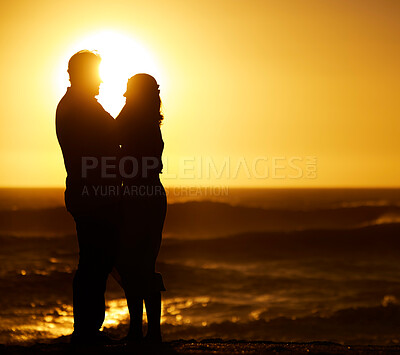 Buy stock photo Silhouette, couple and hug at sunset on beach for vacation, holiday or mockup outdoor. Romantic man and woman in nature with creative sky, space and ocean for love, shadow art and travel or freedom 