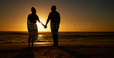 Buy stock photo Beach, sunset and a silhouette couple holding hands on vacation or holiday outdoor. Behind man and woman in nature with creative art, mockup space and ocean for love, care and travel or freedom 