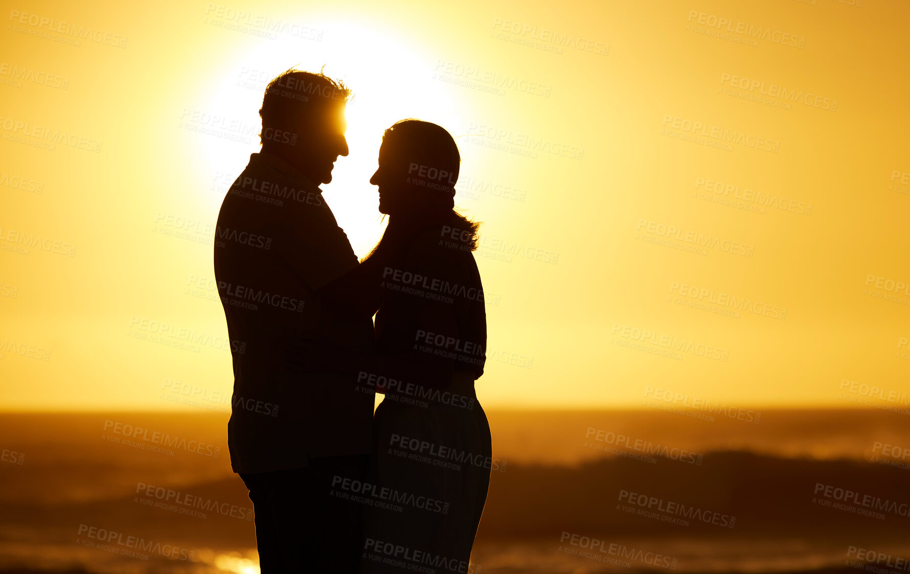 Buy stock photo Silhouette, couple and love at sunset on beach for vacation, holiday or mockup outdoor. Romantic man and woman hug in nature with creative sky background for affection, shadow art and travel freedom 