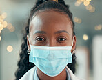 Front face of doctor wearing a covid mask. African american doctor closeup in the office. Portrait of african american doctor in her clinic. Portrait of mask wearing doctor in the hospital.