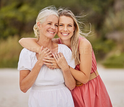 Buy stock photo Beach, mother and daughter hugging in portrait together on a fun summer holiday vacation with smile. Affection, lovely parent or happy woman bonding with mom at sea on weekend trip break in Australia