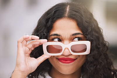 Buy stock photo Fashion, face and woman with sunglasses and a smile while standing outdoor a city background. Young hispanic woman  with funky eyewear, trendy and smiling during summer while carefree and happy