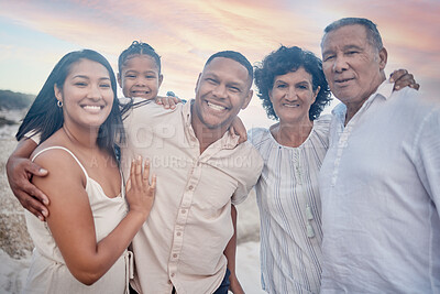 Buy stock photo Portrait of a senior hispanic couple at the beach with their children and grandchild. Mixed race family relaxing on the beach having fun and bonding
