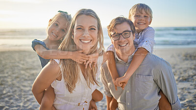 Buy stock photo Portrait of a happy caucasian family standing together on the beach. Loving parents spending time with their two children during family vacation by the beach