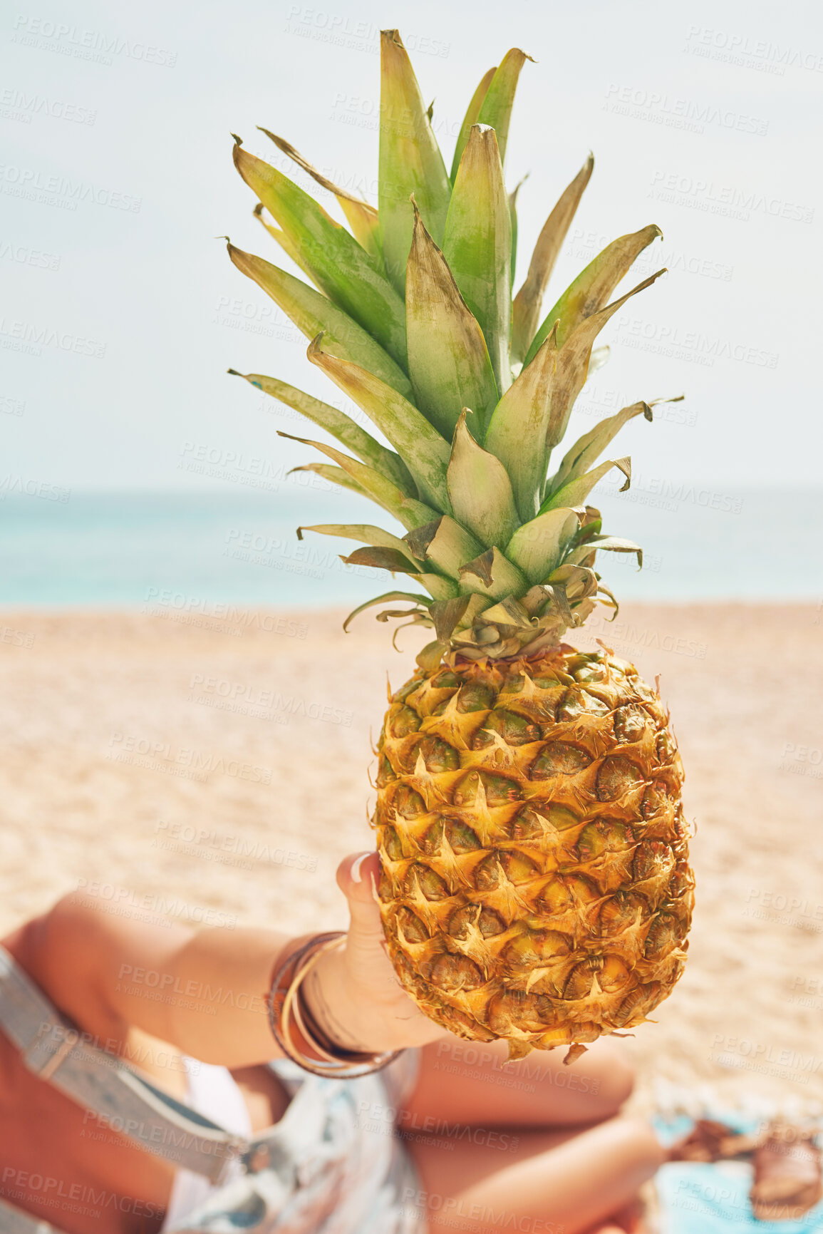 Buy stock photo Pineapple, fruit and beach with woman hands on tropical island with travel, vacation and holiday. Ocean, summer and health food with wellness by sea and sand in Hawaii by water with vitamin c snack