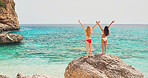 Adventure beautiful friends arms raised on paradise beach on destination summer wanderlust vacation 