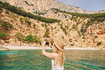 Beautiful woman on speed boat driving to paradise beach island taking photo smart phone discover summer adventure vacation