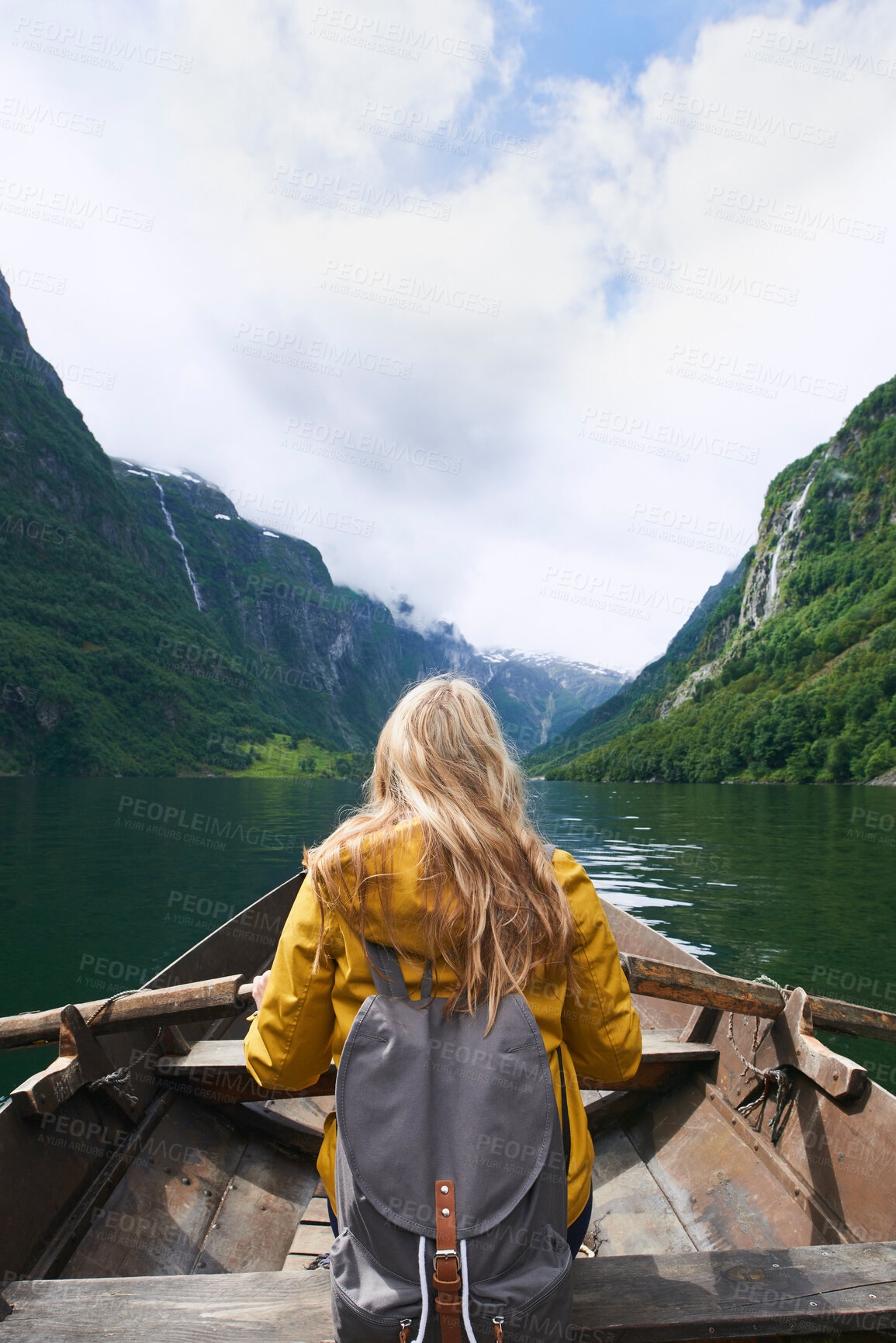 Buy stock photo Adventure woman enjoying majestic river view from row boat epic landscape travel discover explore beautiful earth