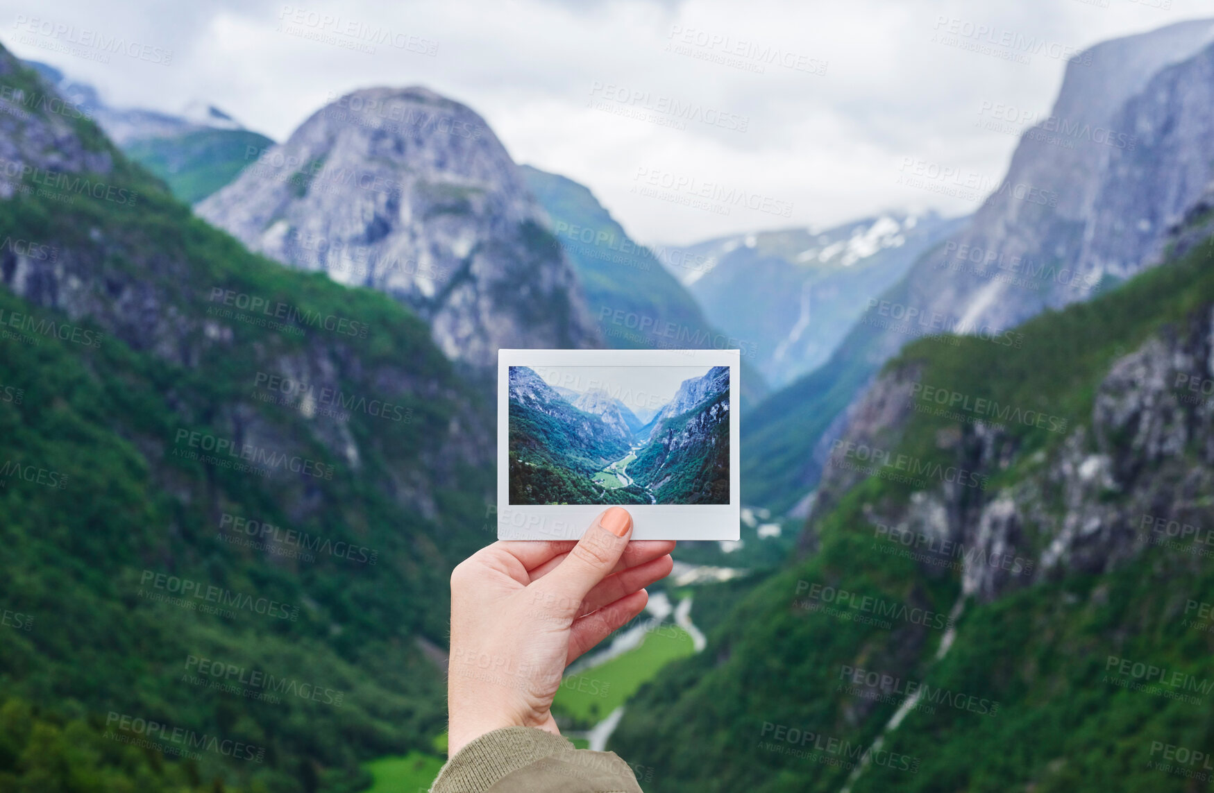 Buy stock photo Hand holding up polaroid instant photo of travel destination glacial valley wanderlust inpiration concept