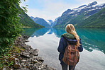 Adventure backpacking woman enjoying view of majestic mountain lake explore travel discover beautiful earth