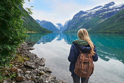 Buy stock photo Adventure backpacking woman enjoying view of majestic mountain lake explore travel discover beautiful earth