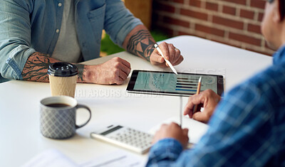 Buy stock photo two businessmen using tablet computer discussing financial graph data on mobile touchscreen device in meeting