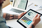 businessman using tablet computer with financial graph data on mobile device screen holding stylus