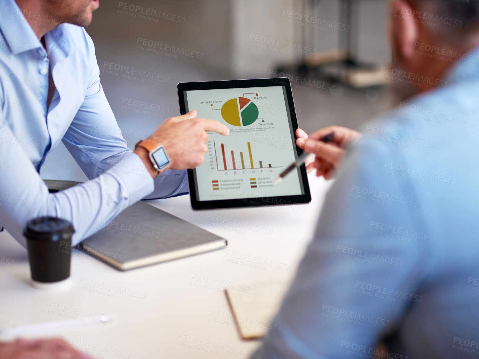 Buy stock photo business people using digital tablet computer discussing financial graph data on mobile touchscreen device in meeting