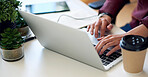 woman hands using laptop computer browsing internet typing emails sitting at table working on notebook