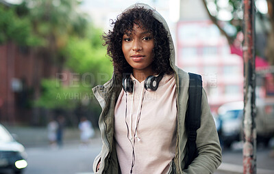 Buy stock photo portrait african american woman in city street wearing headphones