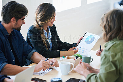 Buy stock photo Young business woman holding document presenting financial data to colleagues in meeting brainstorming ideas using market research
