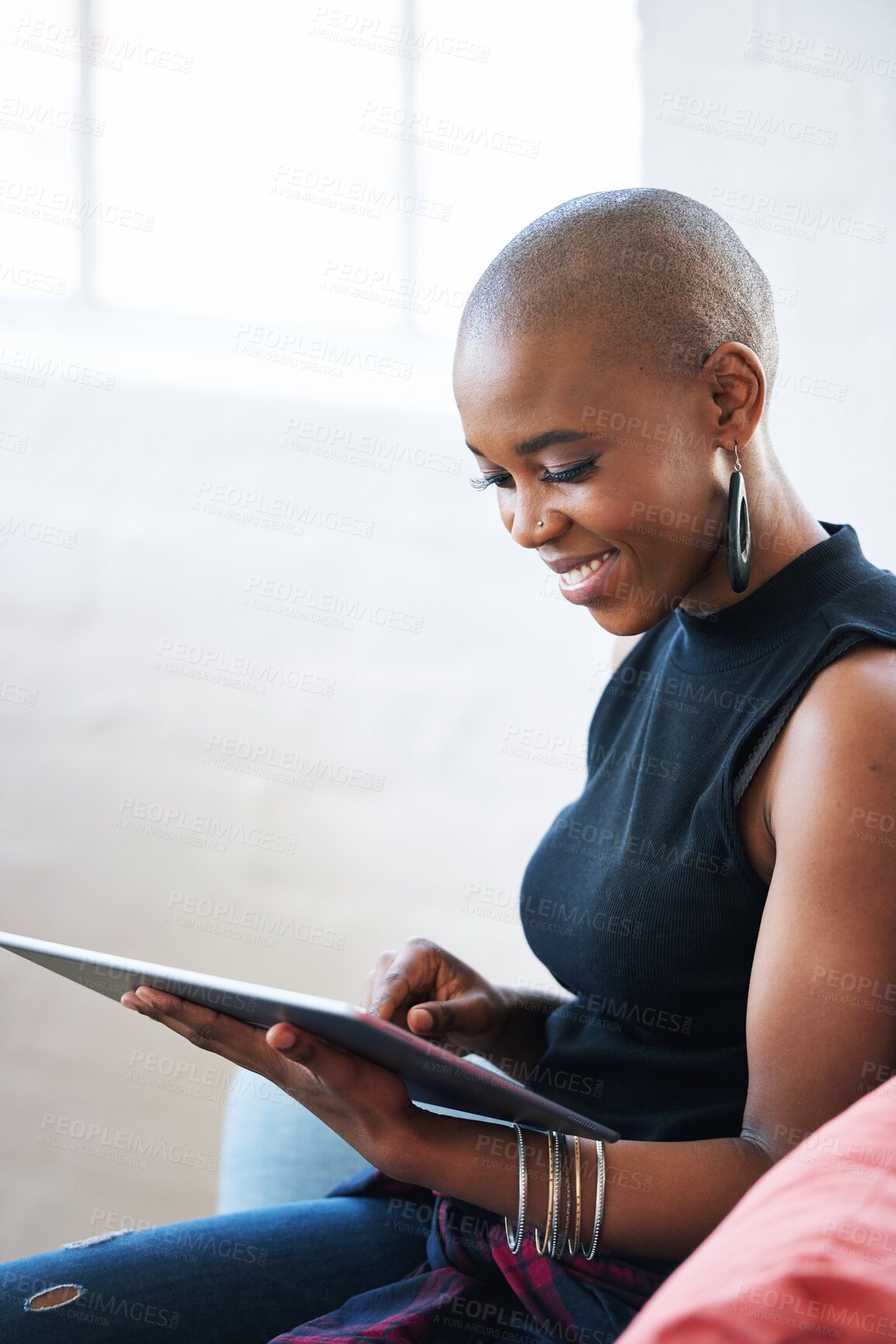 Buy stock photo Bald african american woman using digital tablet computer at home