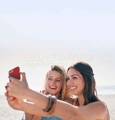 Buy stock photo beautiful woman friends taking photo using smartphone camera on beach smiling happy sharing vacation on social media