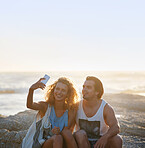 happy couple taking photo using smartphone on beach sharing romantic vacation together