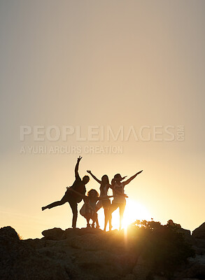 Buy stock photo Group of friends posing standing on rocks at sunset having fun summer vacation lifestyle celebrating friendship