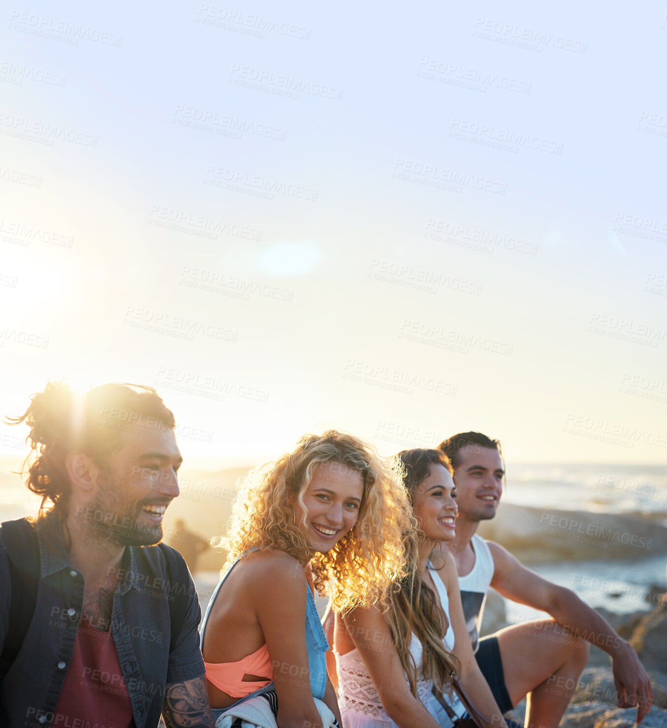 Buy stock photo group of friends on beach enjoying summer holiday students having fun vacation hanging out on beachfront at sunset