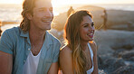 happy couple smiling on beach at sunset enjoying summer