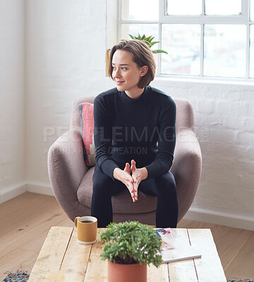 Buy stock photo Beautiful woman smiling looking out window feeling positive sitting on sofa at home