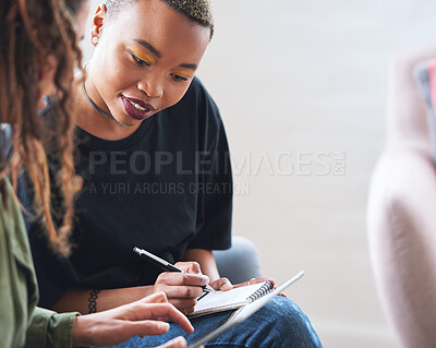 Buy stock photo African american woman writing notes with friend showing ideas on digital tablet computer students brainstorming