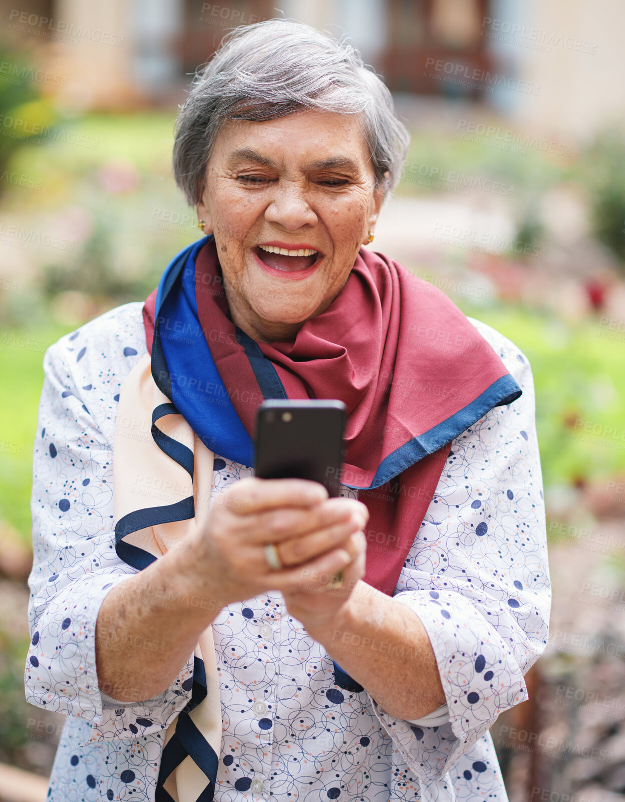 Buy stock photo Senior woman, smile and smartphone for communication, outdoors and online conversation in garden. Elderly person, social media and laughing outside for funny joke on technology, retirement and typing