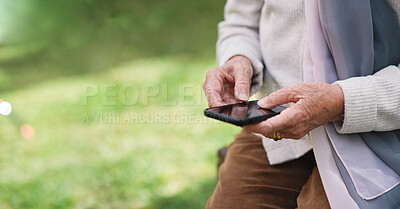 Buy stock photo Senior woman, hands and phone for communication, outdoors and online conversation in garden. Elderly person, social media and typing in retirement, park and internet connection for mobile application