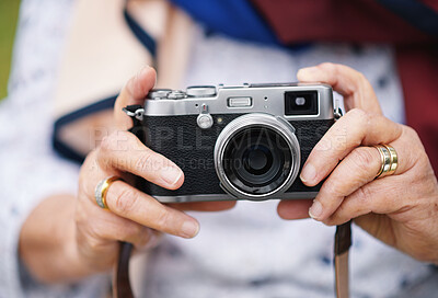Buy stock photo Retro camera, photography and travel with hands of a senior woman taking a picture for travel to explore on an adventure. Closeup of retirement vacation, photographer and memory of a holiday getaway