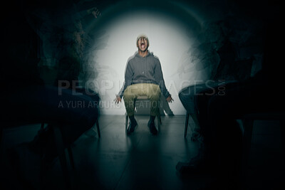 Buy stock photo One African American male suffering mental illness in asylum. Black schizophrenic man experiencing a breakdown while being surrounded by people on a stage theatre performance