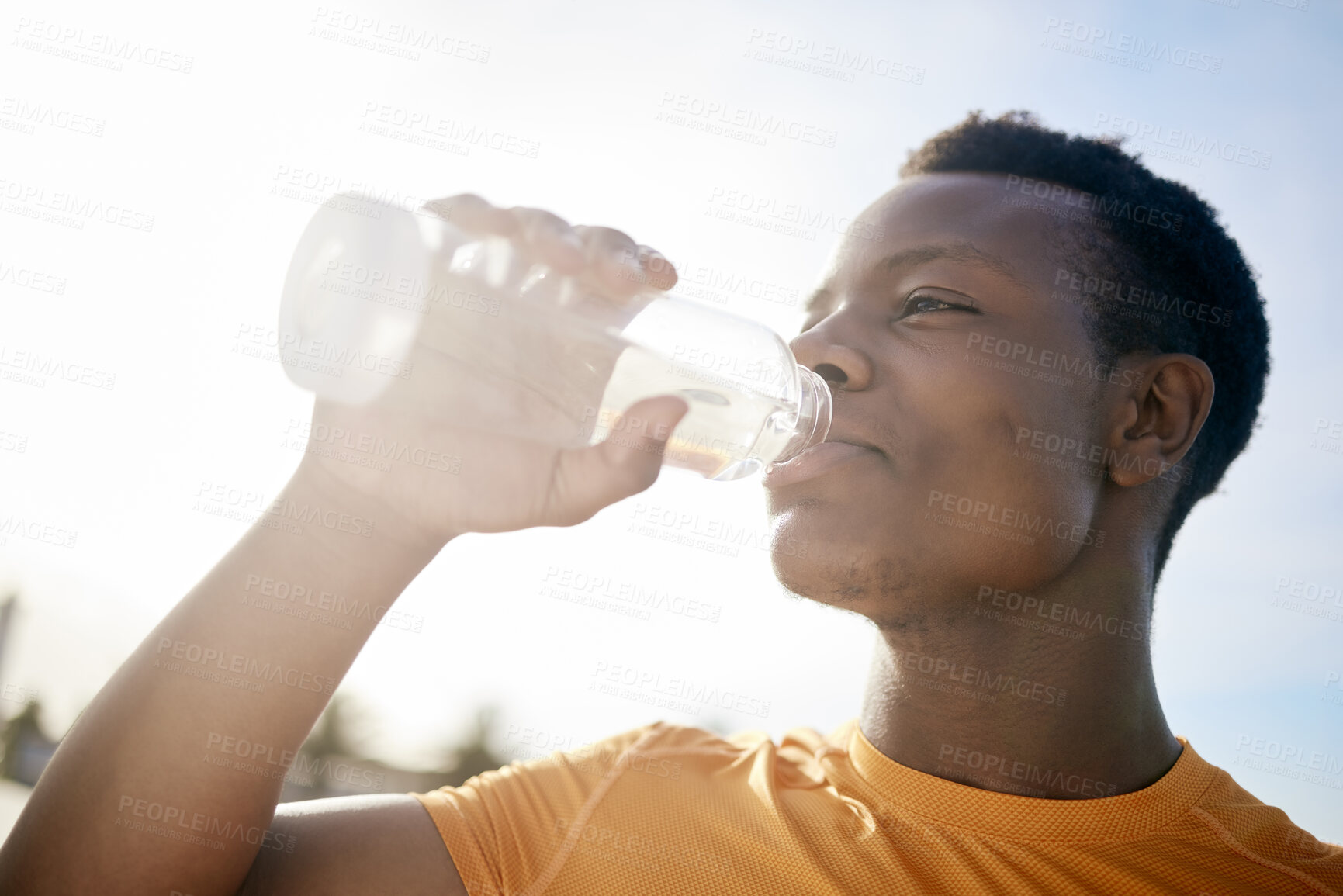 Buy stock photo Fitness, drink and black man with water bottle in exercise, training or outdoor cardio workout. Athlete, drinking and healthy hydration or person relax after running in summer sport practice