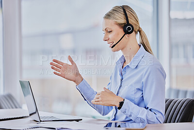 Young caucasian female call centre agent talking on headset and doing a hand gesture looking at her laptop and explaining while working in an office. Confident businesswoman discussing project during online meeting web conference