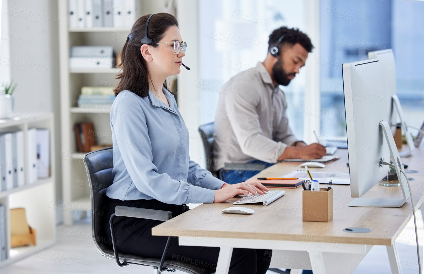 Buy stock photo Business woman, call center and typing on computer in customer service, support or telemarketing at the office. Female person, consultant or agent with headphones on PC for online advice at workplace