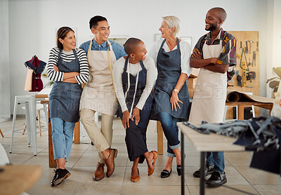 Buy stock photo Group of five cheerful diverse clothing designers standing with their arms crossed in a shop at work. Joyful tailors smiling and laughing while standing together in a boutique