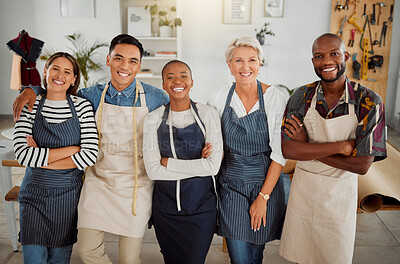 Buy stock photo Portrait of a group of five cheerful diverse clothing designers standing with their arms crossed in a shop at work. Joyful tailors smiling and laughing while standing together in a boutique