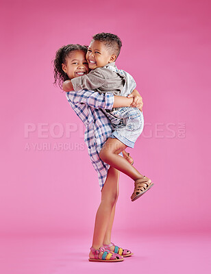 Buy stock photo Two children only posing and being affectionate against a pink copyspace background. African American mixed race siblings bonding in a studio