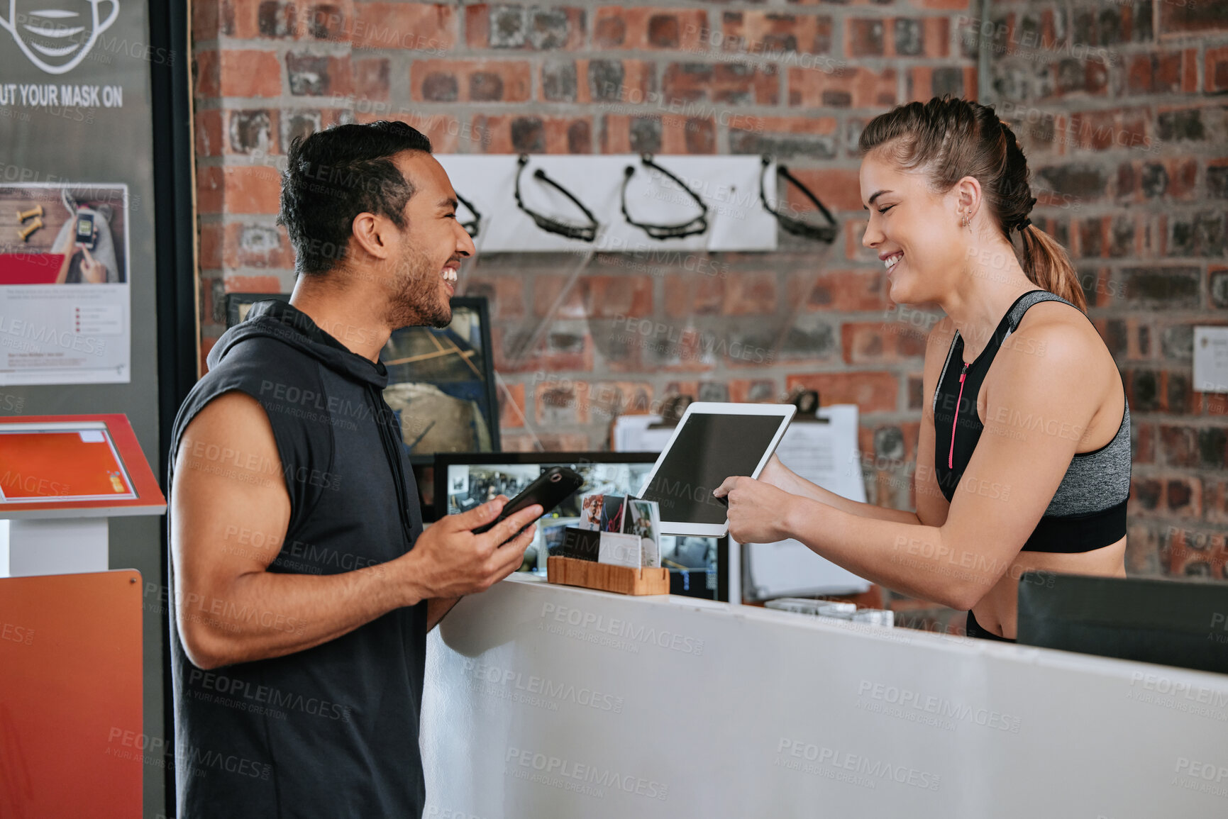 Buy stock photo Talking, tablet fitness and an Asian man with a woman for a gym membership and health app. Happy, showing and an exercise club employee with technology for an athlete for training and sports