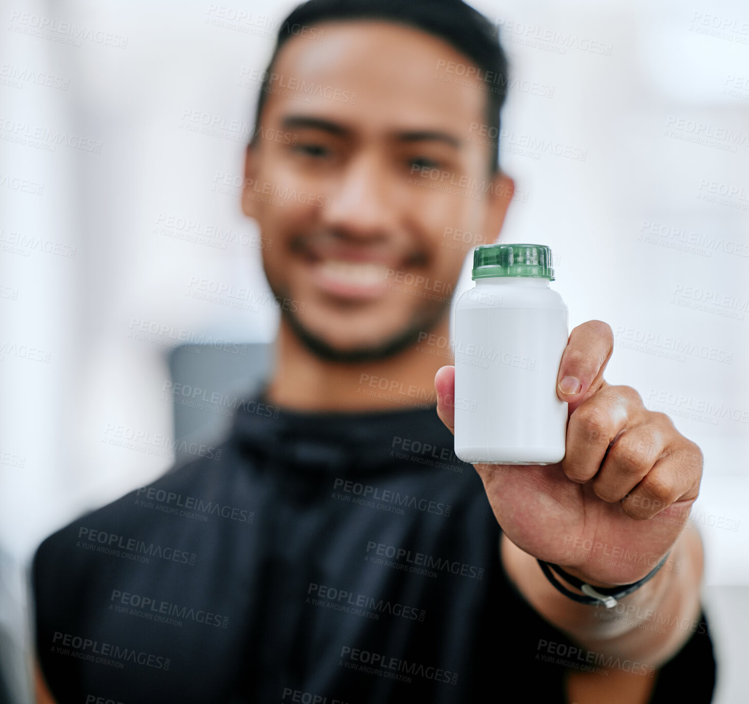 Buy stock photo Fitness drugs, hand and a man at the gym with a supplement for training and sport. Happy, portrait and an Asian athlete showing a bottle of medicine or vitamins for sports wellness and exercise