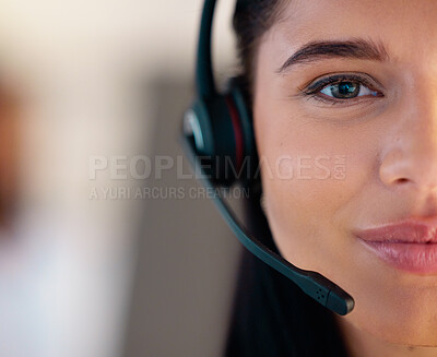 Buy stock photo Closeup portrait of one young caucasian call centre telemarketing agent talking on headset while working in office. Face divided in half of friendly businesswoman operating helpdesk for customer service and sales support