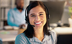 Portrait of one happy young smiling caucasian call centre telemarketing agent talking on headset in office. Face of confident and friendly businesswoman operating helpdesk for customer service and sales support