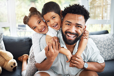 Buy stock photo Portrait of a mixed race father,son and daughter bonding together at home. Hispanic boy and girl hugging and holding their father while smiling on the sofa in the lounge.