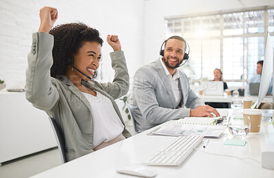 Buy stock photo Young cheerful mixed race female call center agent cheering in joy while answering calls wearing a headset at work. Joyful hispanic businesswoman talking on a call while working on a desktop computer at a desk in an office