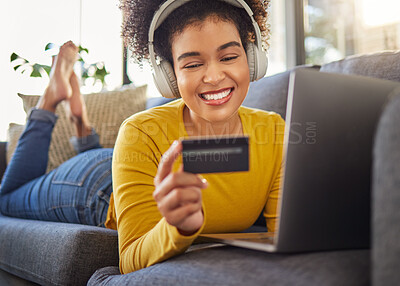 Buy stock photo Headphones, credit card and woman on computer for home online shopping, e commerce or fintech payment on sofa. Relax, music and happy african person on internet banking, audio subscription and laptop