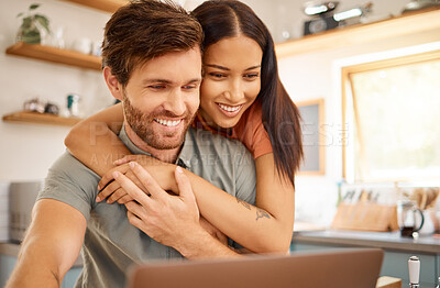 Buy stock photo Young happy interracial couple bonding while using a laptop together at home. Caucasian boyfriend and girlfriend looking at a computer screen. Cheerful husband and wife working on a laptop together