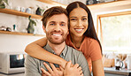 Portrait of a content interracial couple bonding together at home. Joyful mixed race girlfriend embracing her caucasian boyfriend. Happy husband and wife relaxing and spending time together in the morning