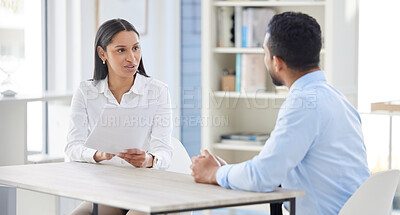 Mixed race hiring manger in interview with businessman. CEO with resume and cv of candidate looking for job opening, vacancy, office opportunity. Applicant sitting and explaining experience to hr boss