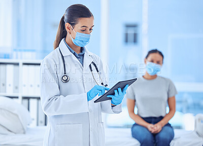Buy stock photo Patient in consult for covid test results. Doctor using a digital tablet in patient consult. Physician checking a patients covid test results. Doctor and patient wearing masks in checkup